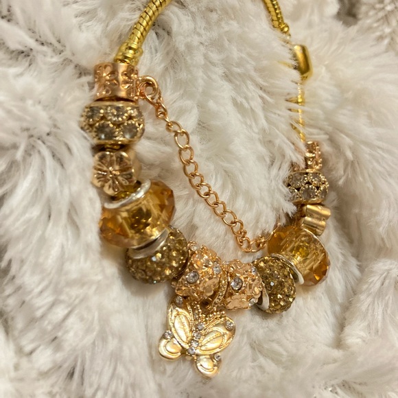 Jewelry - Gold Tone Bracelete With Charms